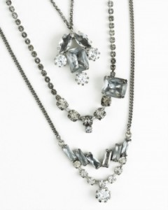 This crystal-encrusted swag of three chains is VERY vintage inspired! I would pair it with a t-shirt as well as a dress. $98 available at JuicyCouture.com